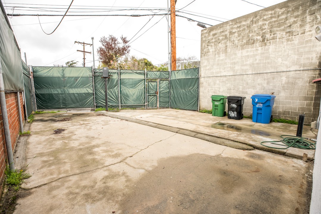 Private paved backyard suitable for exterior filming and staging
